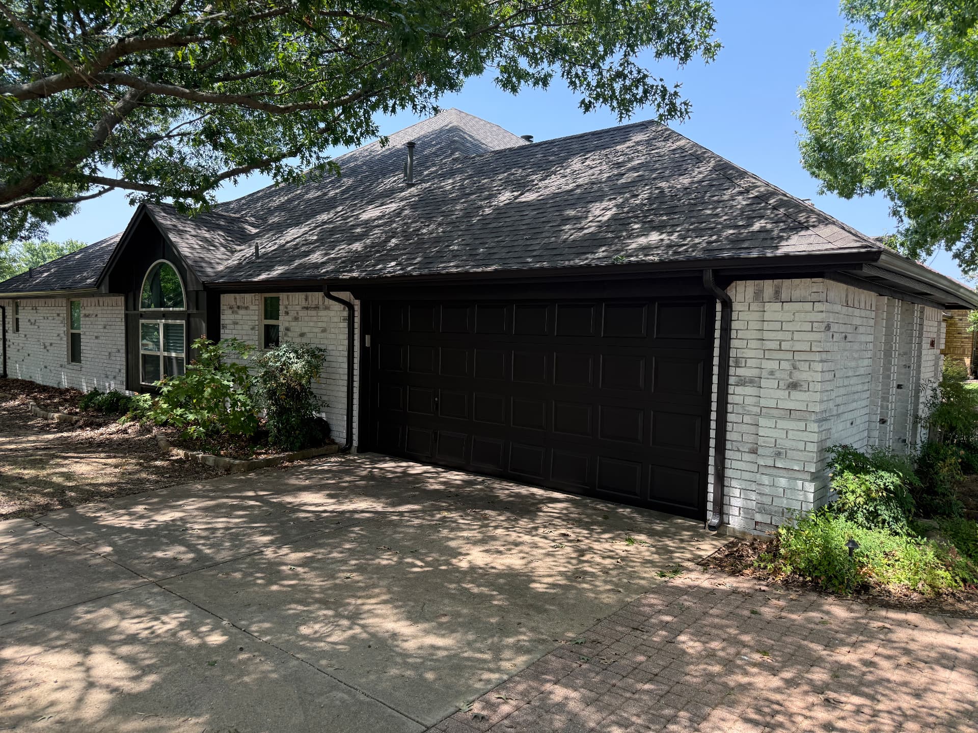 Garage door and trim repainted in satin black