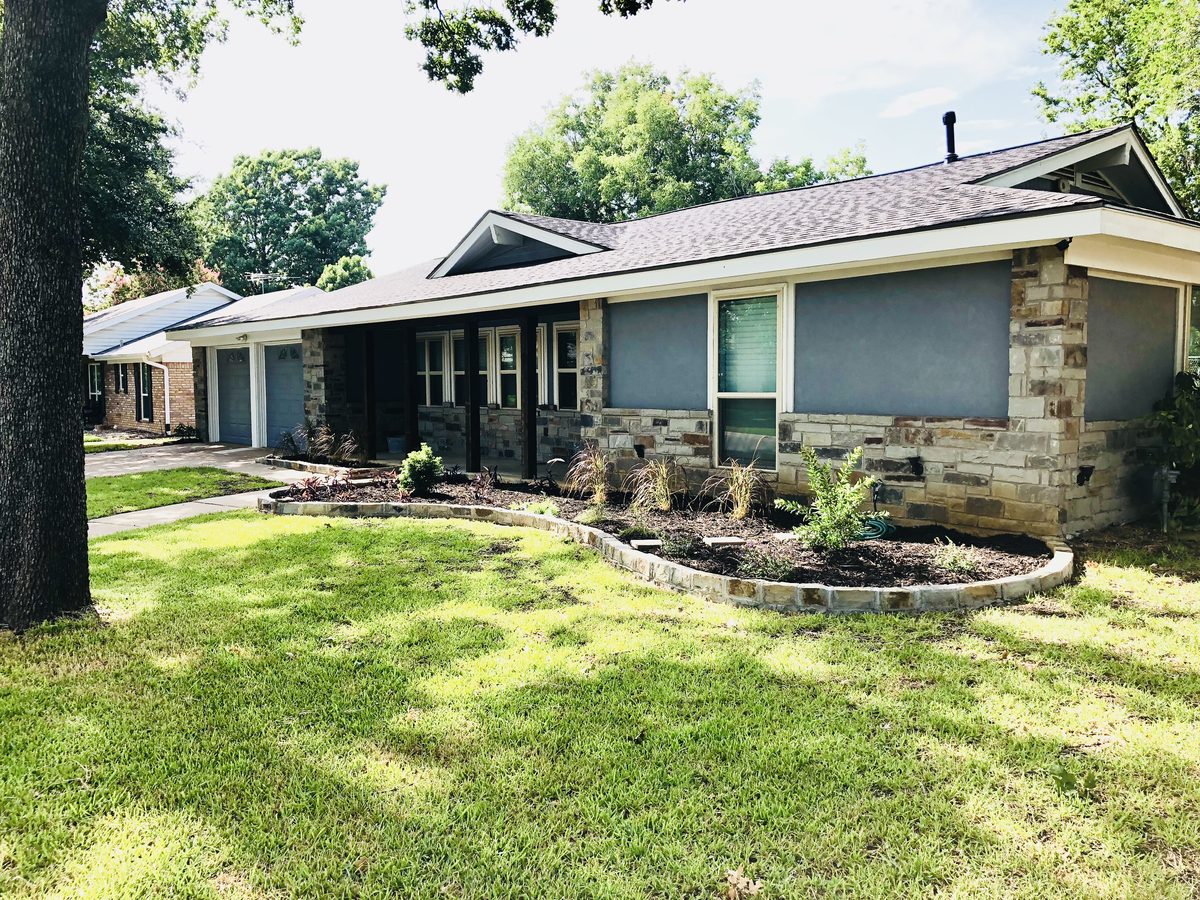 Repainted home exterior with stone accents